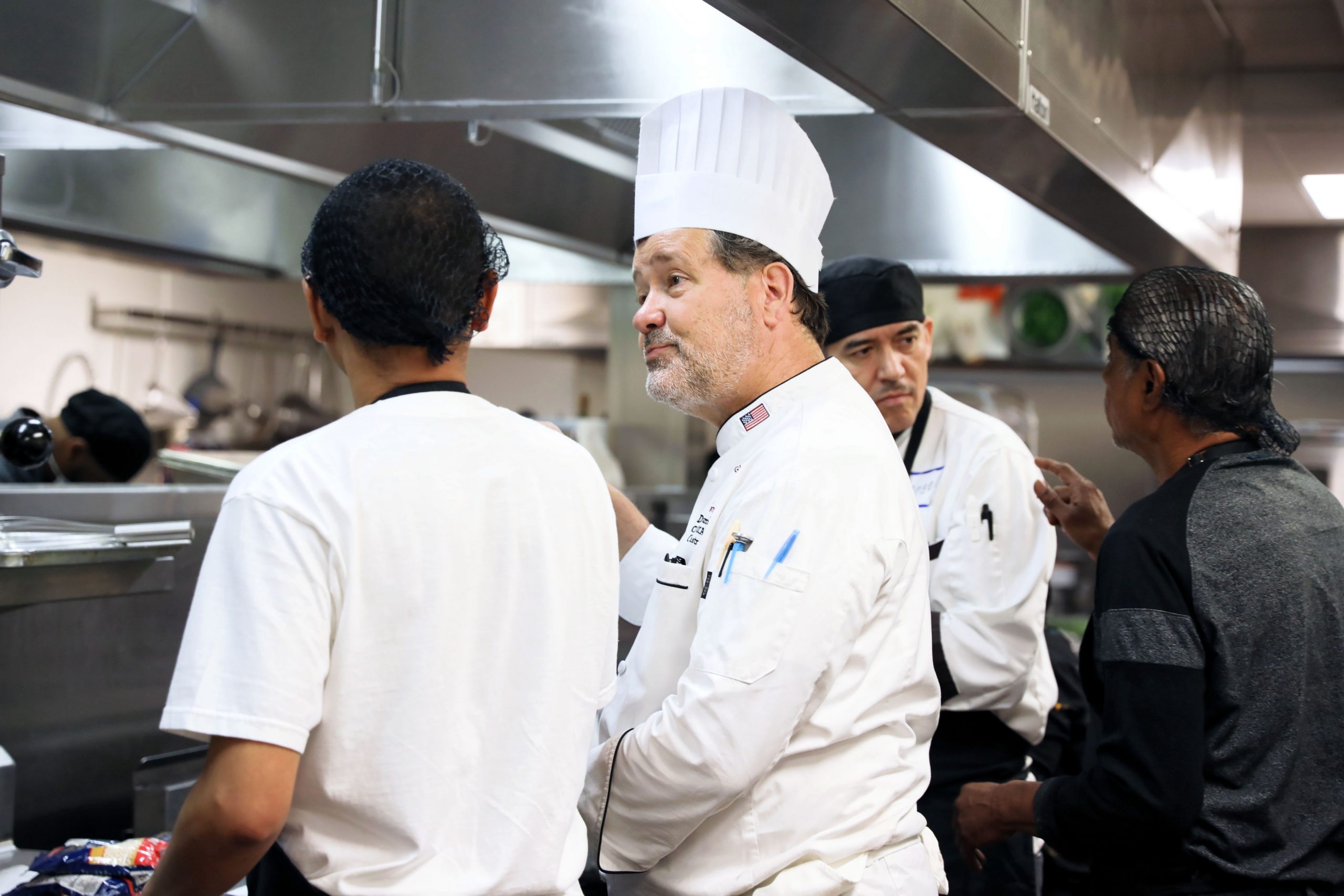 chef speaking to employees