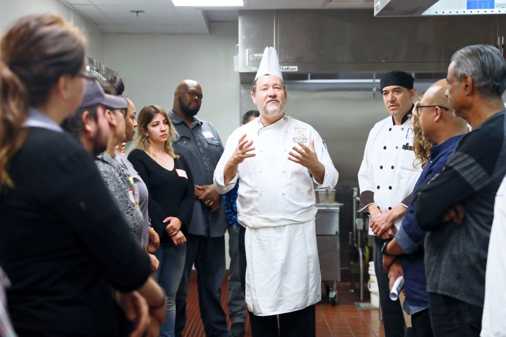 chef speaking to employees